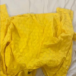 A adjustable length yellow crop top with string